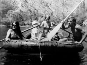 Jacqueline rowing, Fred Dennis at right