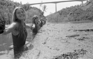 Protestors standing in water