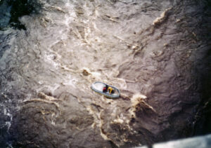 Upside down raft in a rapid